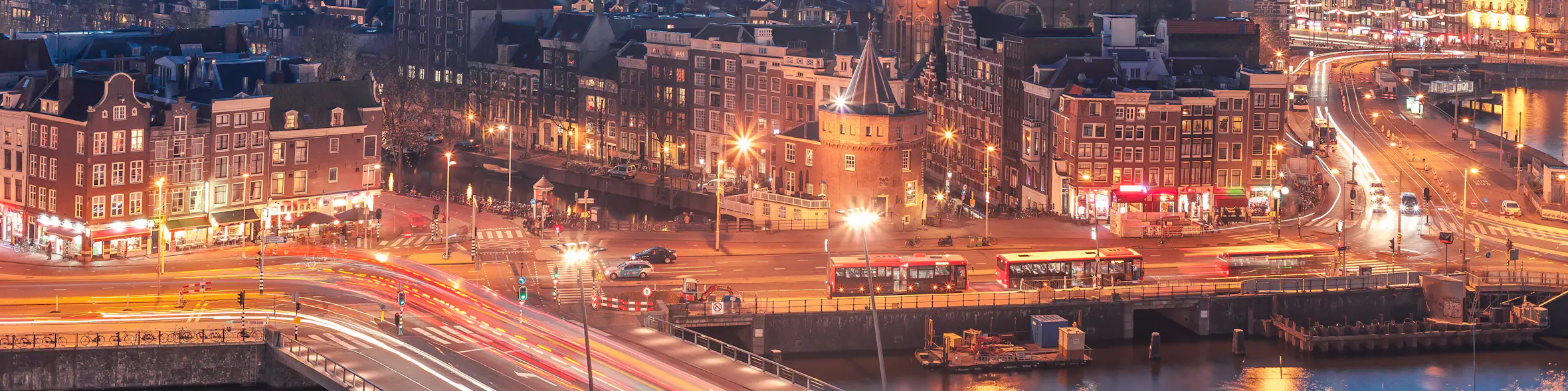 A cityscape of Amsterdam in the Netherlands featuring iconic elements of Amsterdam's architectural landmarks.