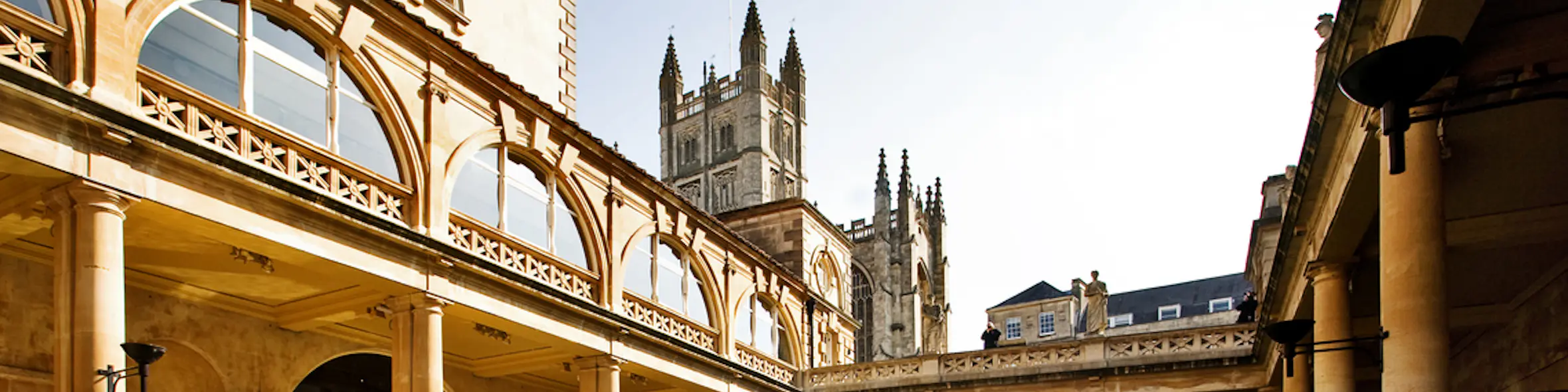 A cityscape of Bath in the UK featuring iconic elements of Bath's architectural landmarks.