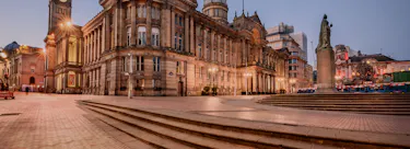 A cityscape of Birmingham in the UK featuring iconic elements of Birmingham's architectural landmarks.