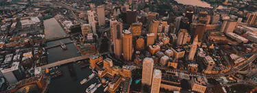 A cityscape of Boston, Massachusetts in the USA featuring iconic elements of Boston, Massachusetts's architectural landmarks.