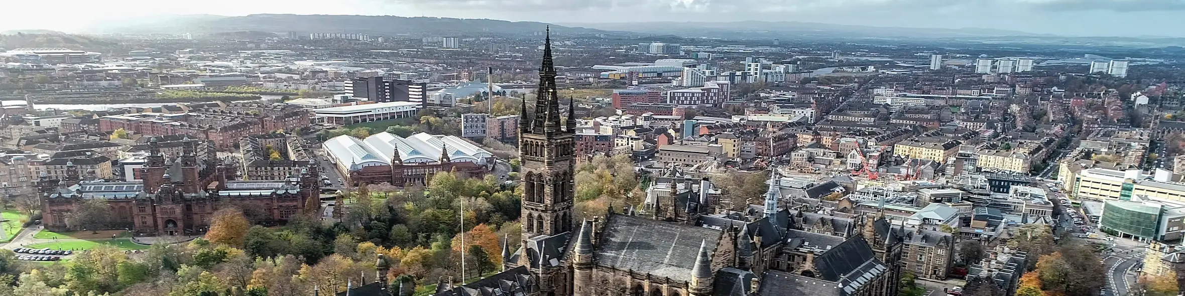 A cityscape of Glasgow in the UK featuring iconic elements of Glasgow's architectural landmarks.
