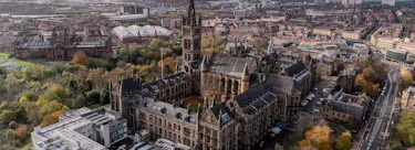 A cityscape of Glasgow in the UK featuring iconic elements of Glasgow's architectural landmarks.