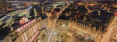 A cityscape of Leeds in the UK featuring iconic elements of Leeds's architectural landmarks.