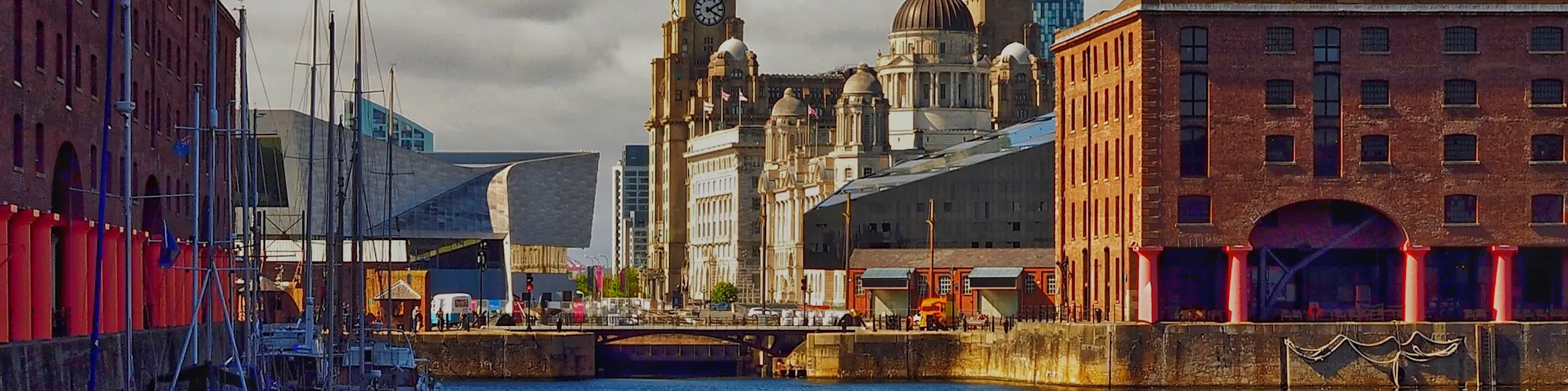 A cityscape of Liverpool in the UK featuring iconic elements of Liverpool's architectural landmarks.