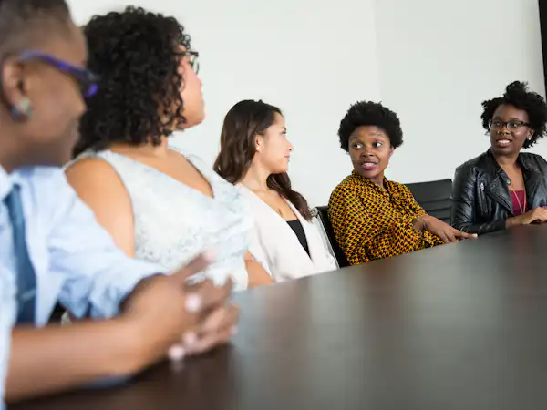 Five students having a discussion