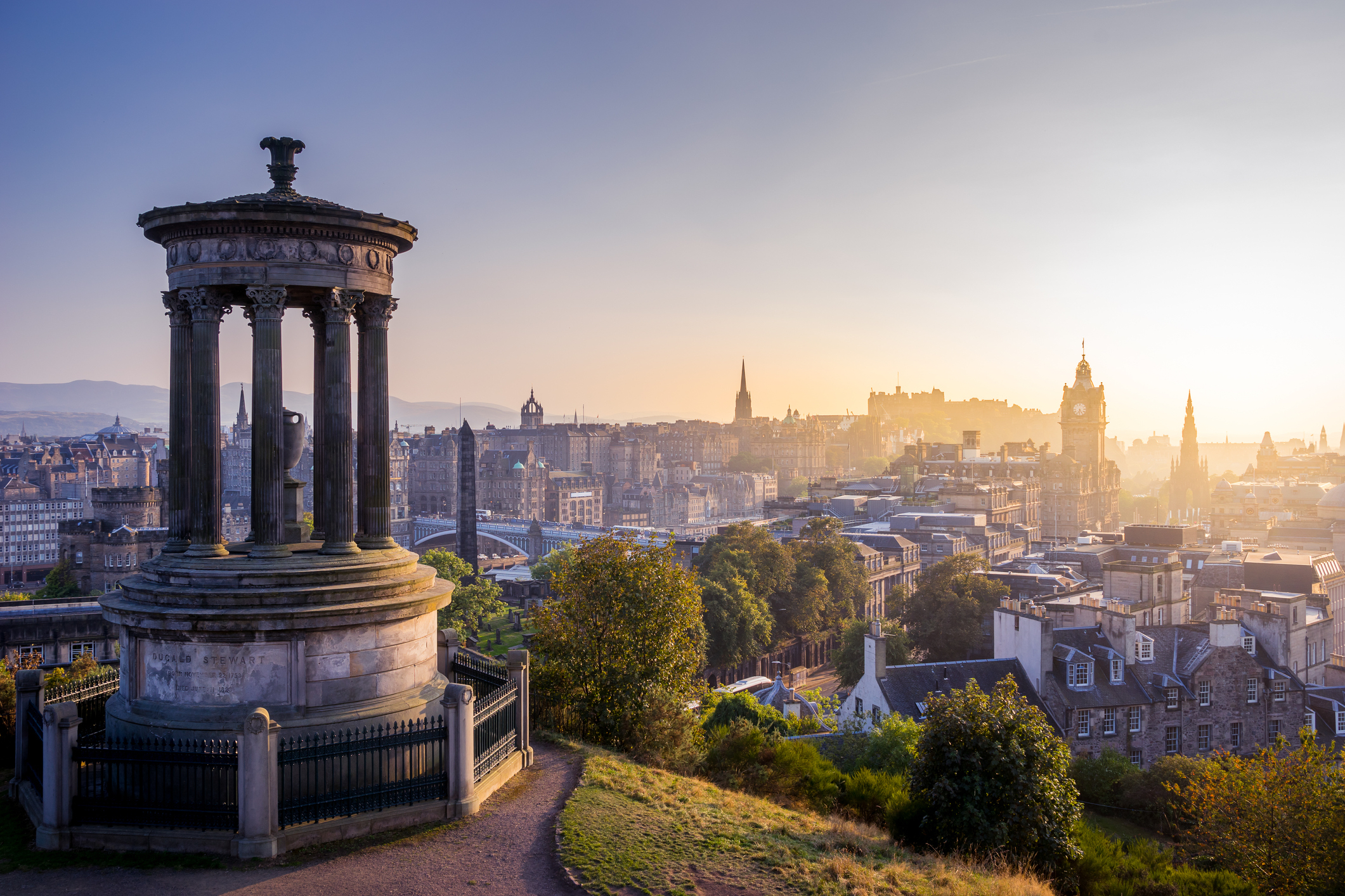 A famous cityscape or landscape of Scotland featuring iconic elements of Scotland's natural beauty or architectural landmarks.